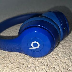 Lightly used blue Beats headphones comes with the case and the cord.